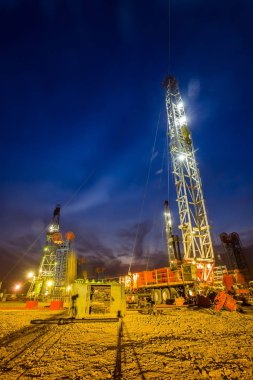 In the evening of oilfield derrick clipart