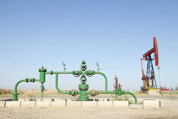 Oil field scene, oil pipelines and facilities