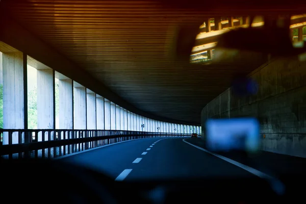 car driving through tunnel; highway tunnel