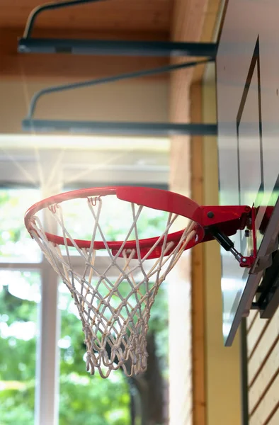 Basketball net and frame in a school gym sports hall low angle selective focus.Closeup of basketball hoop background. — Stock Photo, Image