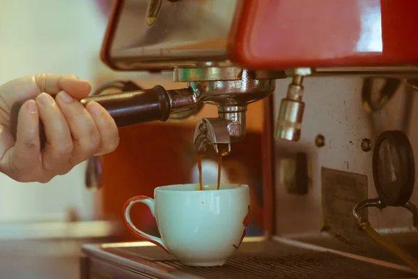 Espresso coffee pouring vintage tone
