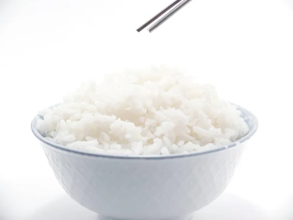 Rice in a bowl closeup with chopsticks on top isolated — Stock Photo, Image