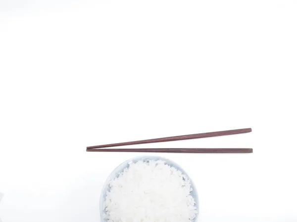 Rice in a bowl with chopsticks isolated top view (copy space) — Stock Photo, Image