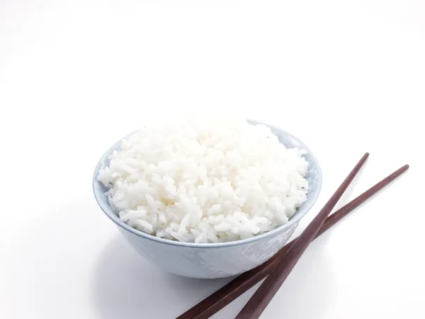 Rice in a bowl with chopsticks isolated — Stock Photo, Image