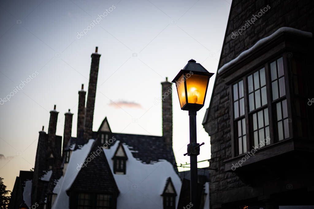 Hogsmeade village - the snow on roof top house in the evening at Universal Studios in Osaka, Japan.