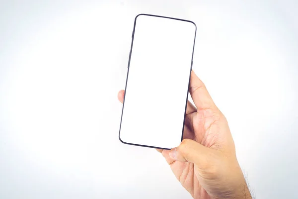 Menneskets Hånd Holder Den Moderne Smartphone Hvid Baggrund Blank Skærm Royaltyfrie stock-fotos