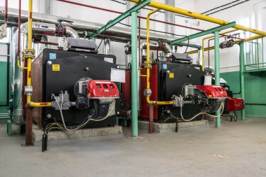 Bendery, Moldova - 27 Nisan: Isıtma kazanları Isıtma su ICI Caldaie ve gaz brülörleri Riello Moldova ısıtma tesisi için