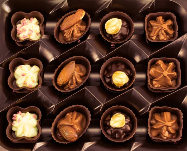 Fondo chocolate confeti surtido — Foto de Stock