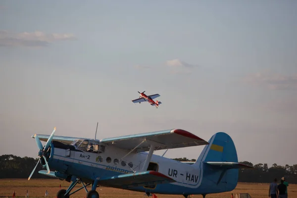 AN-2 aircraft with small on the sky — Stock Photo, Image