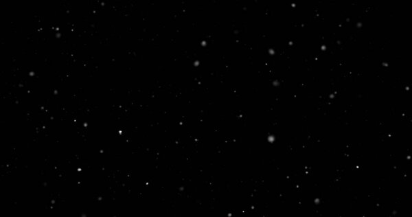 Flying dust particles on a black background