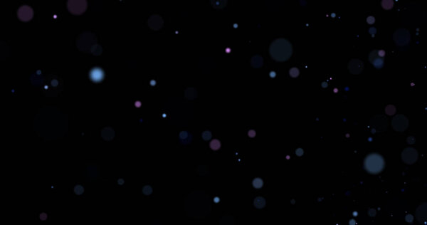 Flying dust particles on a black background