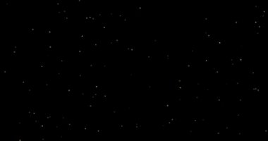 Siyah arkaplanda uçan toz parçacıkları