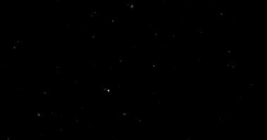 Siyah arkaplanda uçan toz parçacıkları