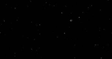 Siyah arkaplanda uçan toz parçacıkları