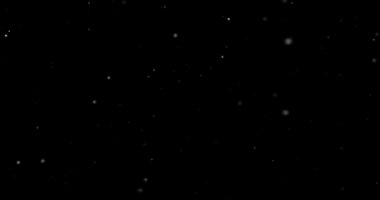 Siyah arkaplanda uçan toz parçacıkları