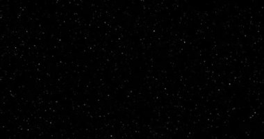 Siyah arkaplanda uçan toz parçacıkları