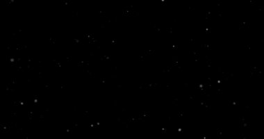 Siyah arkaplanda uçan toz parçacıkları