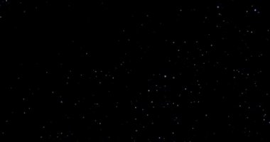 Siyah arkaplan videosundaki soyut uçan toz parçacıkları