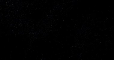 Siyah arkaplan videosundaki soyut uçan toz parçacıkları