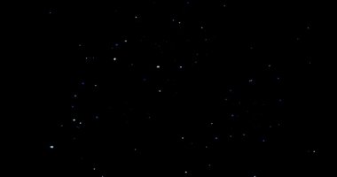 Siyah arkaplan videosundaki soyut uçan toz parçacıkları