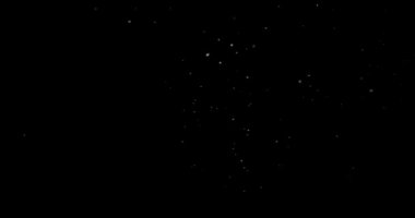 Siyah arkaplan videosundaki soyut uçan toz parçacıkları