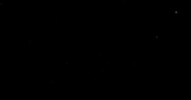 Siyah bir arkaplanda soyut uçan toz parçacıkları