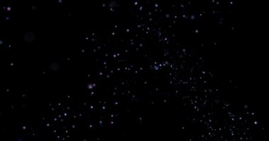 Siyah arkaplanda uçan toz parçacıkları