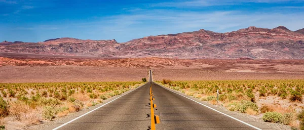 road lines in death valley desert, california, usa