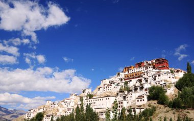 Leh palace in heart of Ladakh, Jammu and Kashmir, Indian with blue sky and pretty cloud in background. clipart