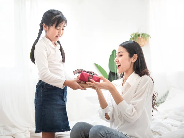 Happy Little Daughter Giving Present Her Young Beauty Asian Mother — Stock Photo, Image