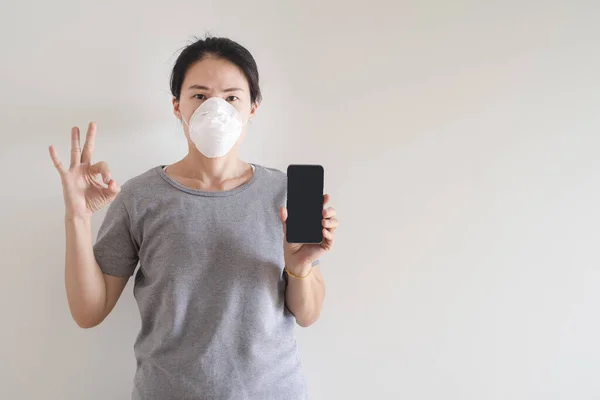 Asian Young Woman Using Smart Phone Wearing Face Mask Protect — Stock Photo, Image