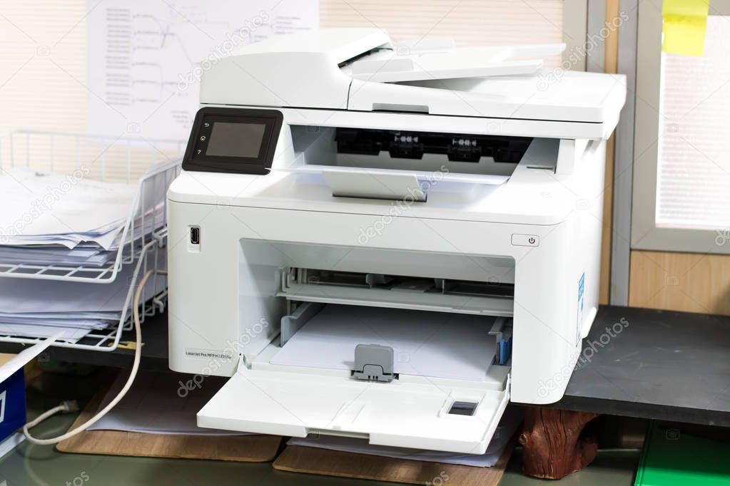 White printer and paper