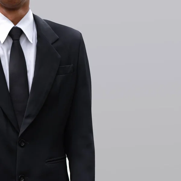 Uomo d'affari vestito e sfondo colore grigio . — Foto Stock