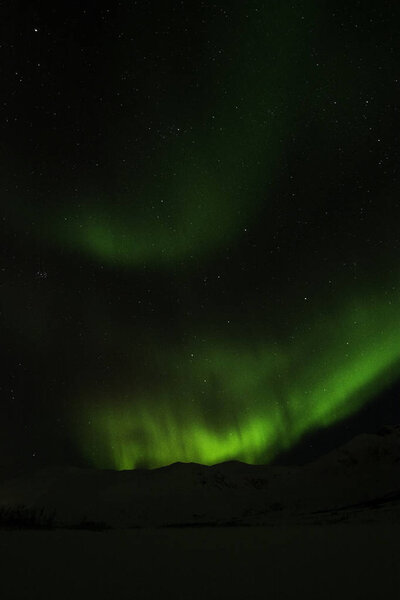 Северное сияние рядом с Тромсо, Норвегия
