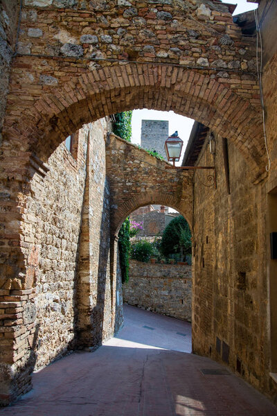 San Gimignano is a small walled medieval hill town in the province of Siena, Tuscany, Italy. Known as the Town of Fine Towers, San Gimignano is famous for its medieval architecture,