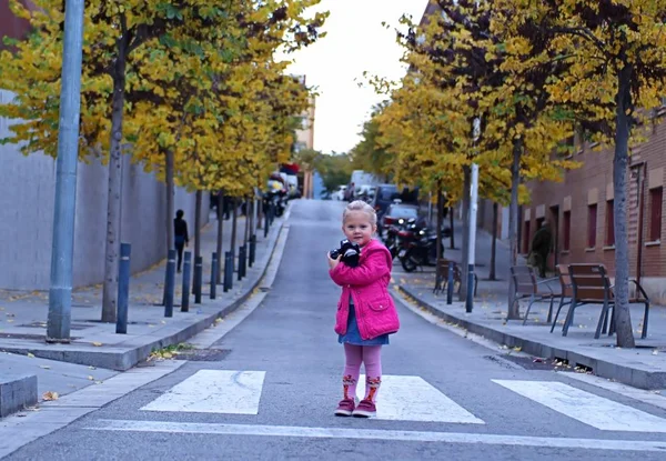 Little Beautiful Blonde Girl Pink Jacket Stands Pedestrian Crossing Holds — Stock Photo, Image