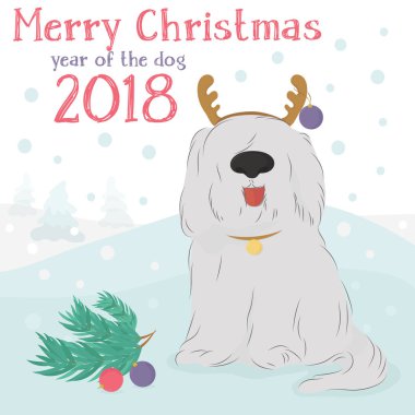 Dekoratif bir Ren geyiği ve Noel topları ile tüylü köpek.