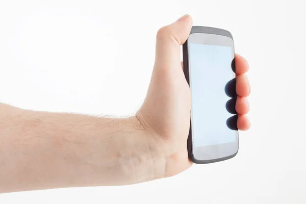 Uomo in possesso di telefono moderno su sfondo bianco — Foto Stock