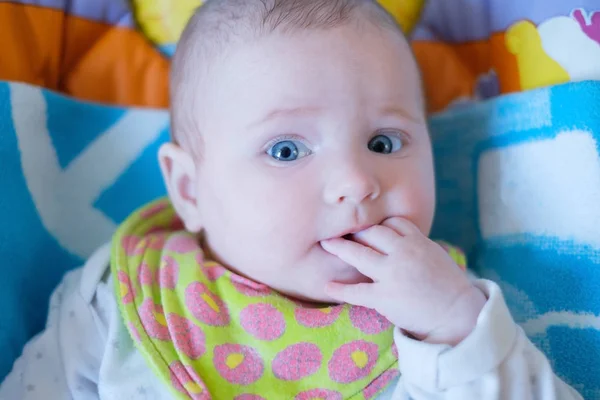 Portrait of the child with a finger in a mouth — Stock Photo, Image