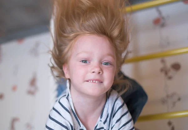 Little smiling girl swinging close up portrait. — Stock Photo, Image