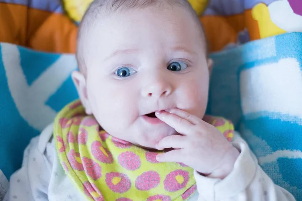 Portrait of the child with a finger in a mouth — Stock Photo, Image