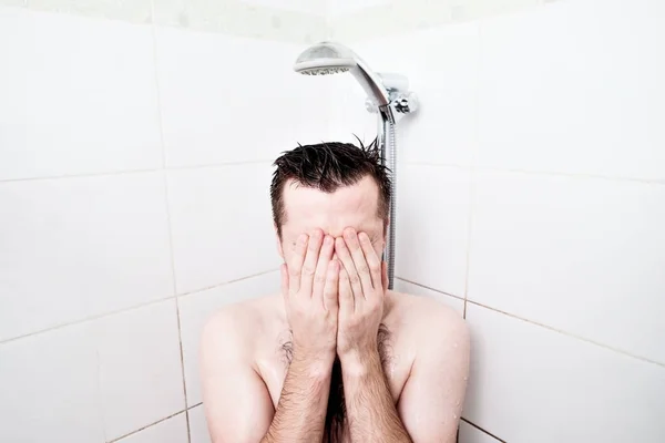 Man having a relaxing shower. Relax in the shower after a hard days work. — Stockfoto