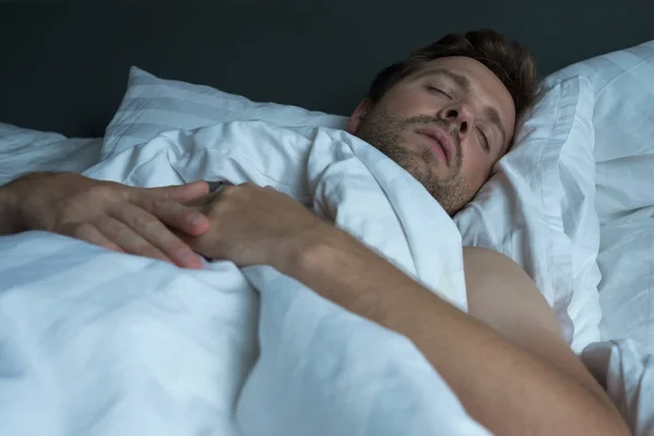 Caucasian man napping with happy face expression. — Stock Photo, Image