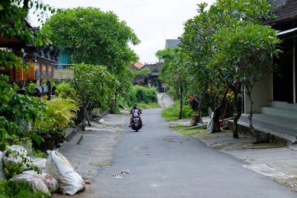 BALI, INDONESIA - DECEMBER 13, 2017: Rural road in Bali Indonesia.