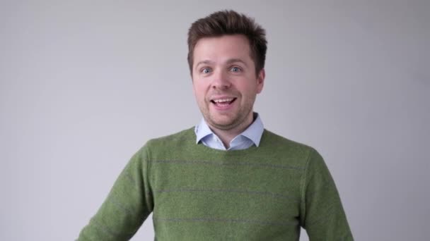 Happy man with thumbs up gesture, isolated on white — Stock Video