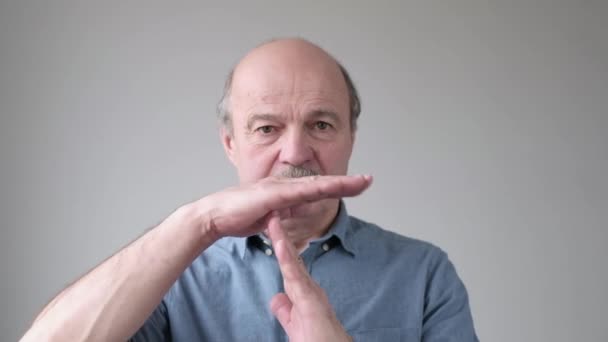 Senior hispanic man showing time out hands gesture. Stop I need a pause — Stock Video