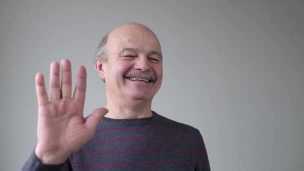 Laughing positivesenior man showing stop gesture, asking to stop joking — Stock Video