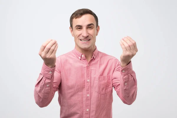 Joven hombre guapo mostrando gesto italiano que significa lo que quieres —  Fotos de Stock