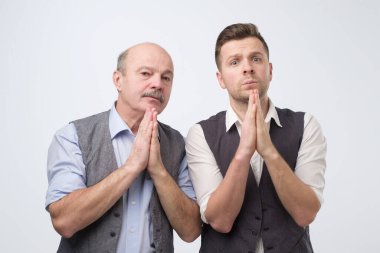 Please help us concept. Two caucasian men need a help asking for support.