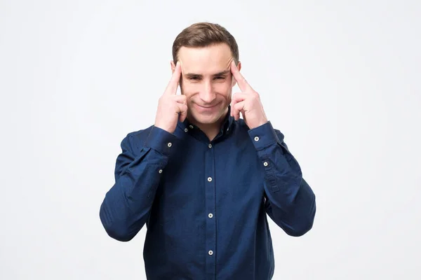Young Caucasian Male Keeps Fingers Temples Selects Best Suitable Solution — Stock Photo, Image